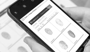 person holding a phone with images of fingerprints