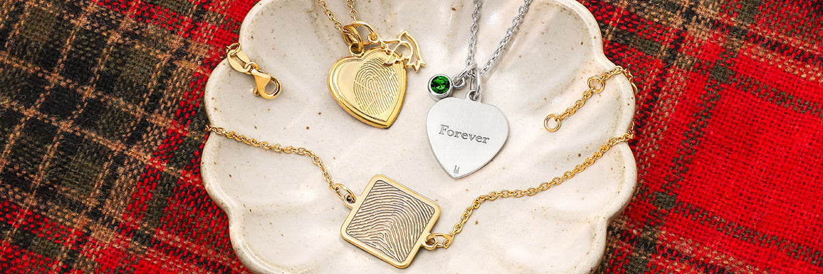 gold and silver fingerprint charms on necklaces and bracelets