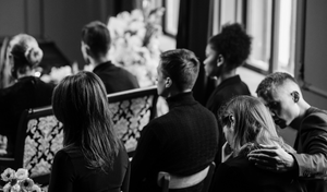 black and white photo of people at a funeral