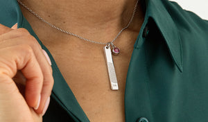woman wearing a vertical bar pendant fingerprint necklace