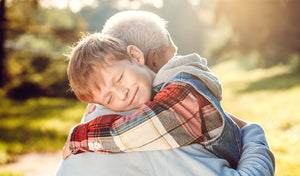 grandchild hugging grandparent