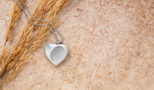 sterling silver urn pendant for ashes engraved with a fingerprint