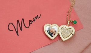 yellow gold heart shaped locket engraved with fingerprint on a card that says mom