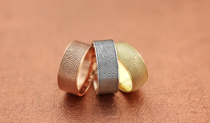 rose gold, sterling silver, and yellow gold fingerprint rings