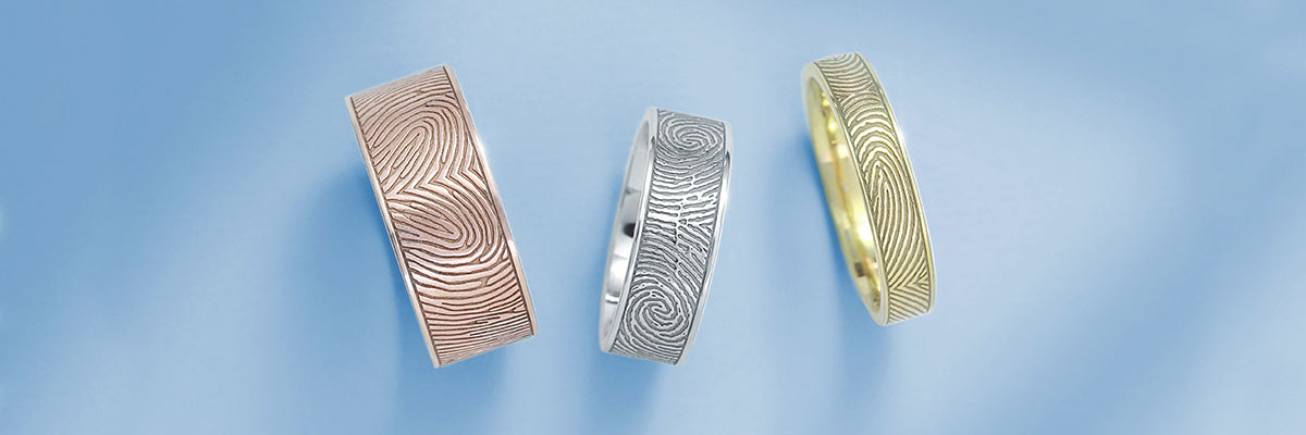 flat fingerprint rings in silver, rose gold, and yellow gold