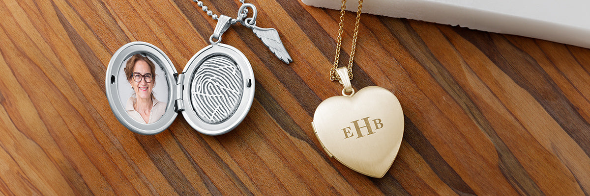woman holding a sterling silver oval locket engraved with a fingerprint alongside a picture of a veteran