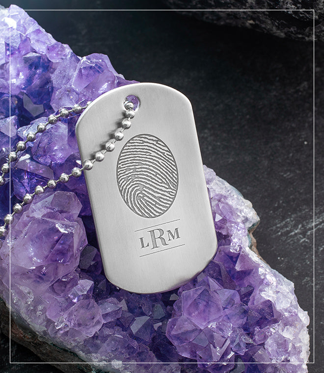 stainless steel military dog tag engraved with a fingerprint and monogram