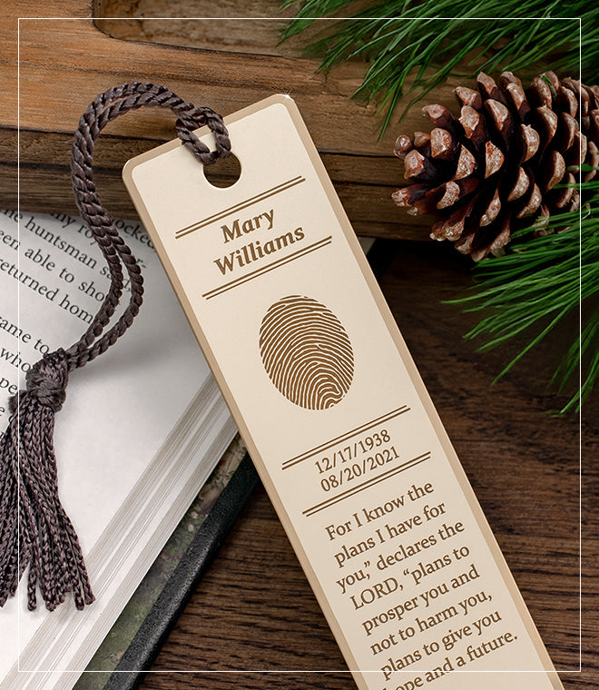 brass bookmark personalized with an engraved fingerprint and inscription